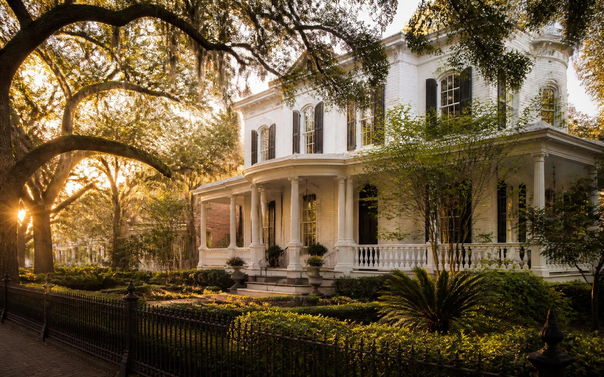 Restored historic home framed by live oaks in Savannah, Georgia